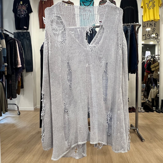 Silver sequin dress on a hanger in a clothing store