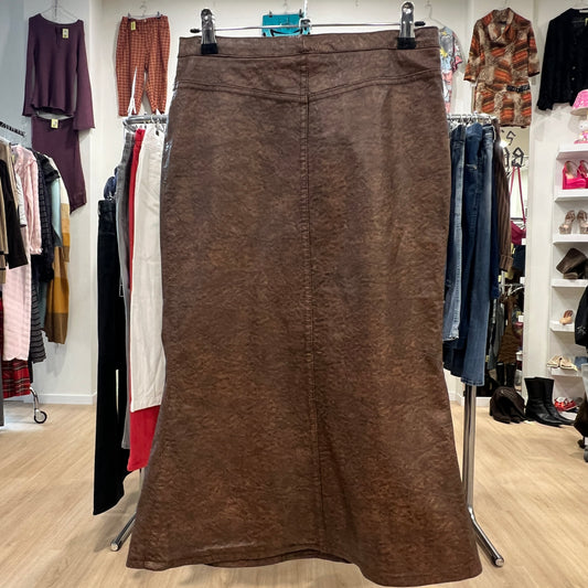 Brown skirt hanging on a rack in a clothing store