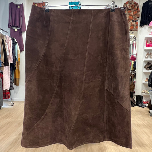Brown suede skirt displayed in a clothing store