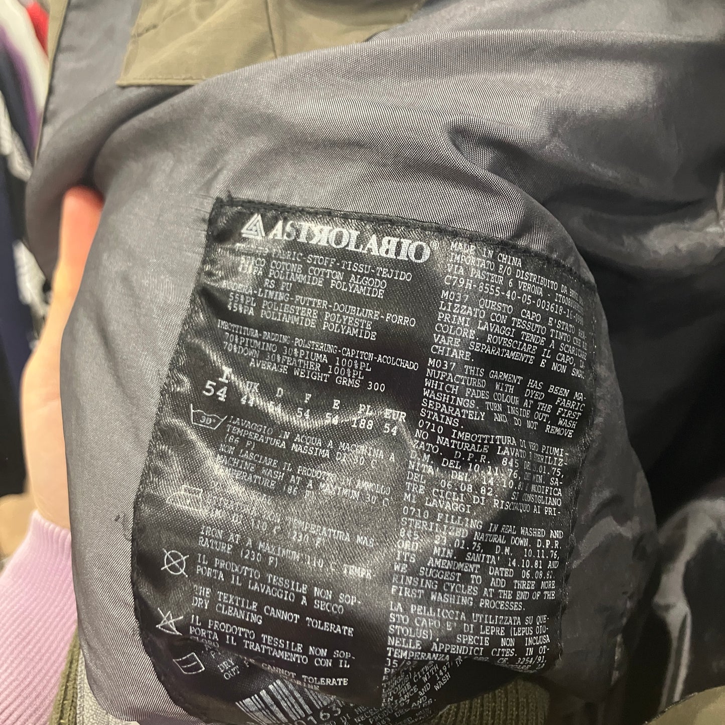 Close-up of a label on a jacket with text and symbols