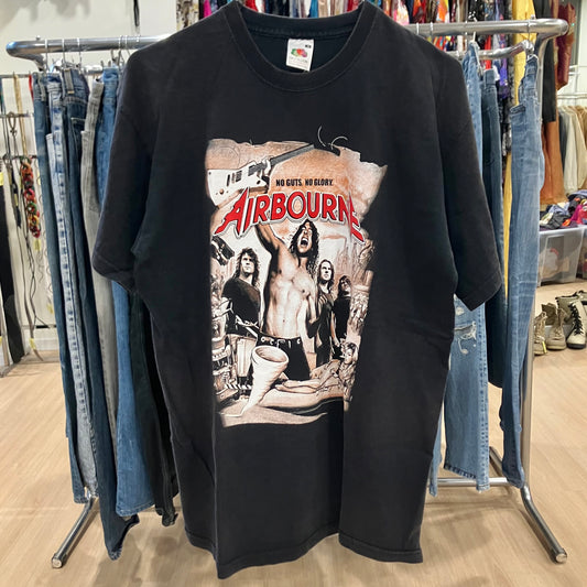 Black t-shirt with 'Airbourne' graphic design on a clothing rack