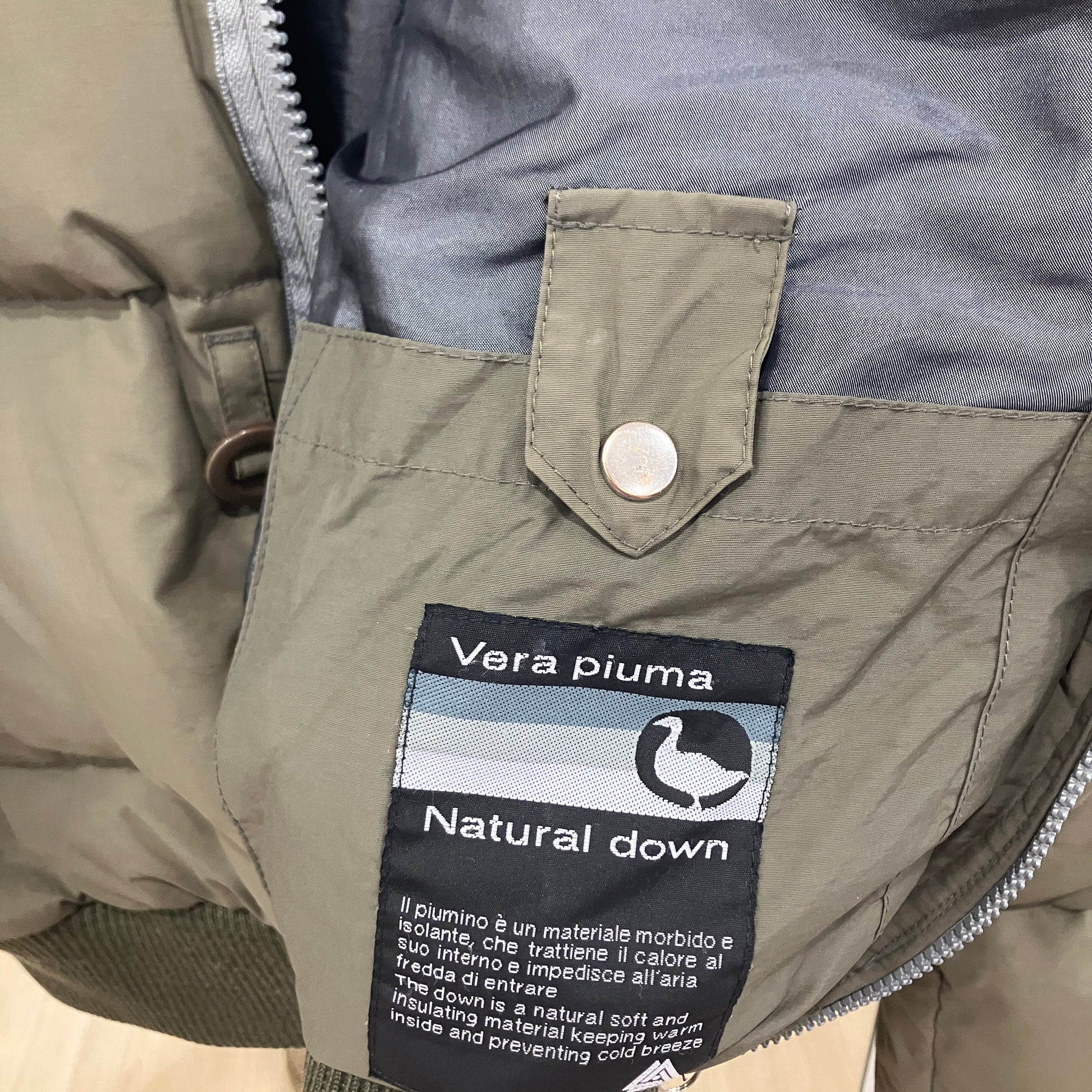 Close-up of a jacket with a Vera Piuma natural down label