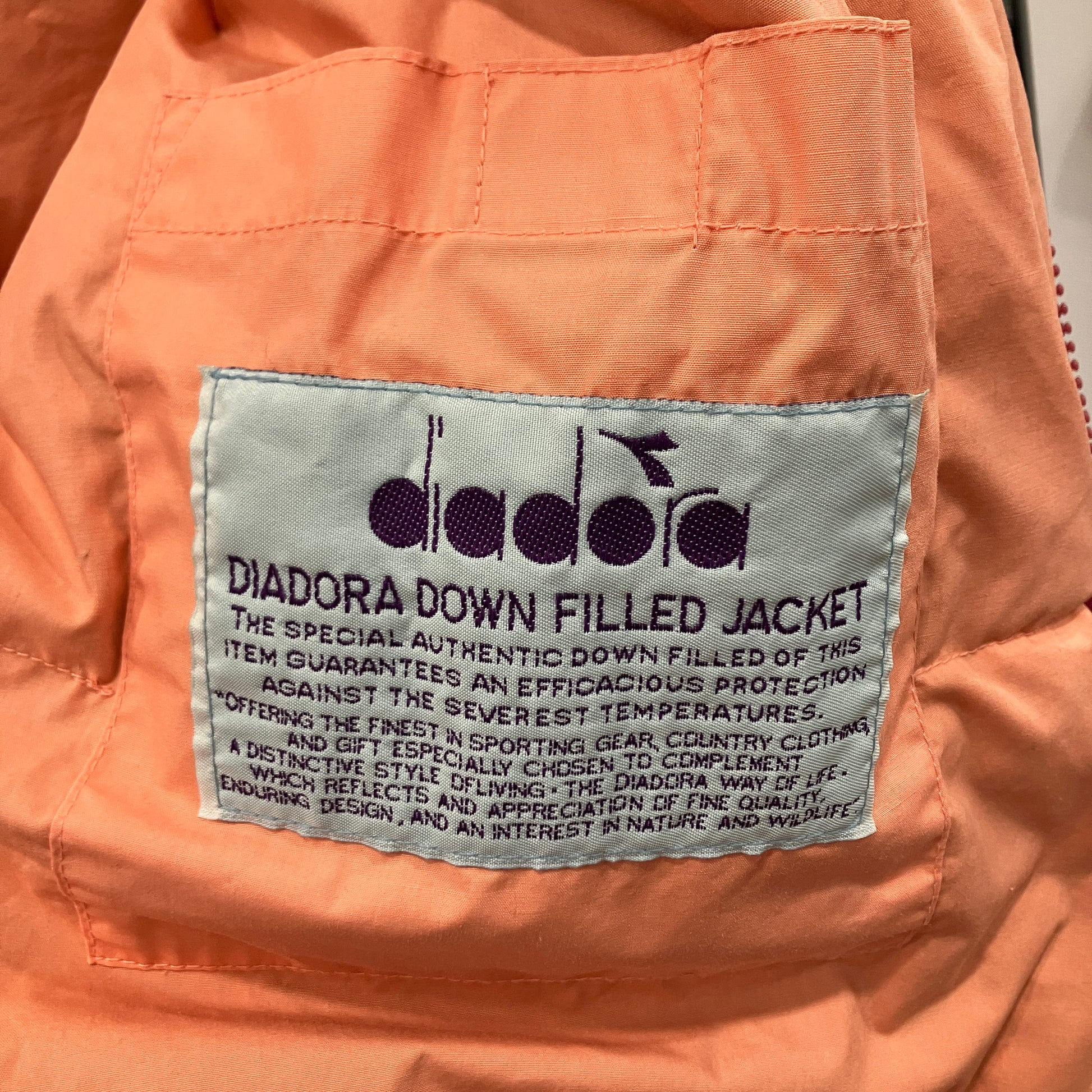 Diadora label on an orange jacket