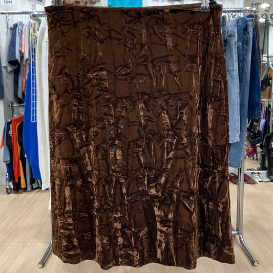 Brown textured skirt on a rack in a store setting