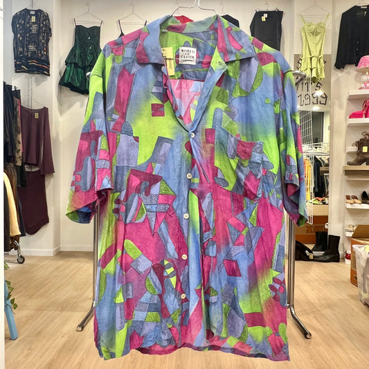 Colorful patterned shirt on a rack in a store setting