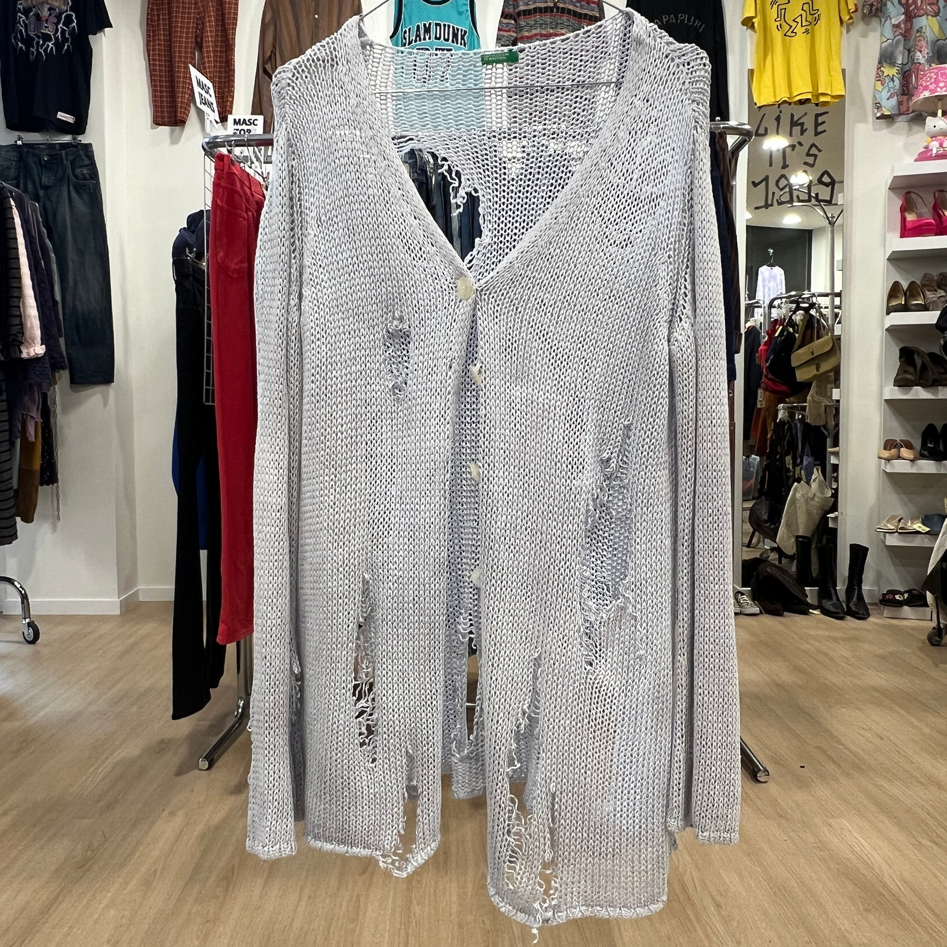 Silver sequin dress on a hanger in a clothing store