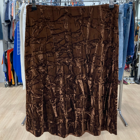 Brown textured fabric on a rack in a store setting