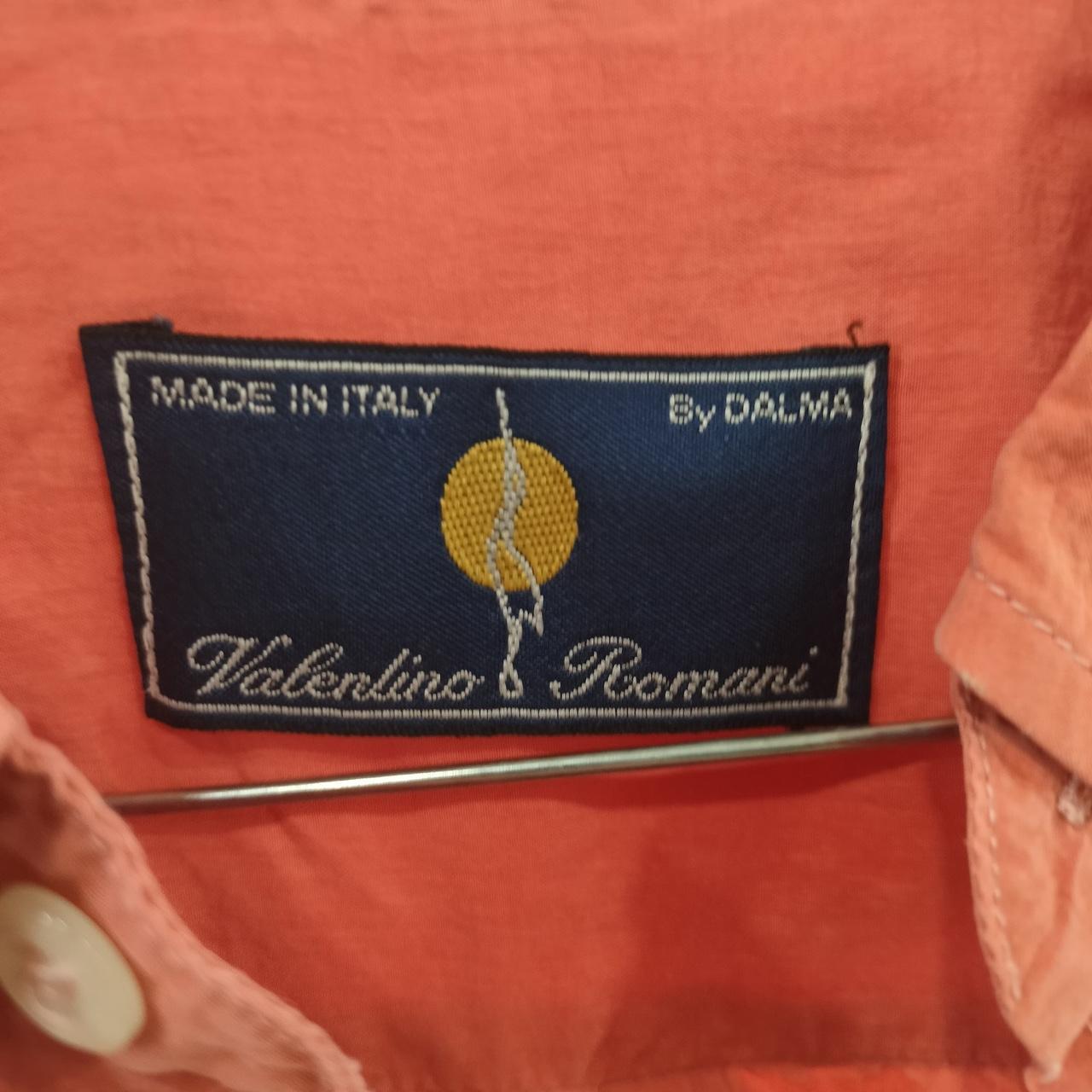 Valentino Romani label on a garment with 'Made in Italy' text
