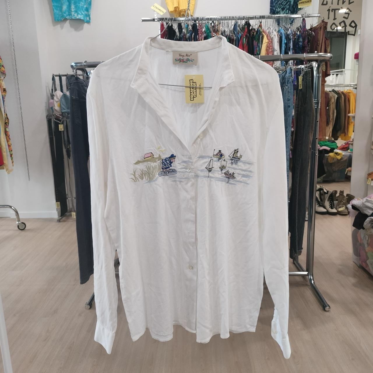 Very nice white embroidered button-down shirt with a sailing embroidery