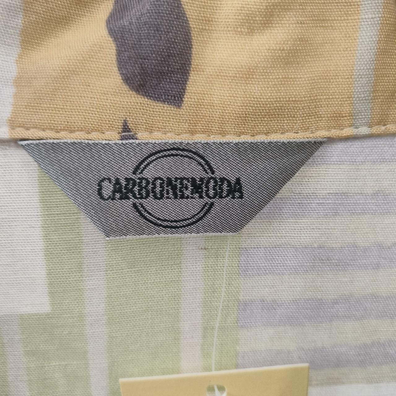 Camouflage-patterned fabric with a Carbone Moda label