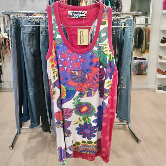 Colorful tank top with floral pattern on a clothing rack in a store
